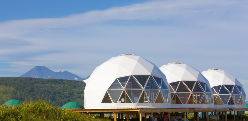 capsule dome house designs, The Glamping house  and volcano, rural landscape, tent houses in Kamchatka peninsula. Selective focus.